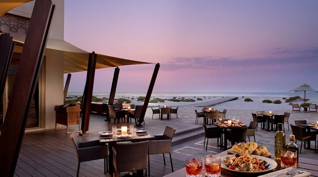 What is the food and drinks like at Beach House Abu Dhabi?