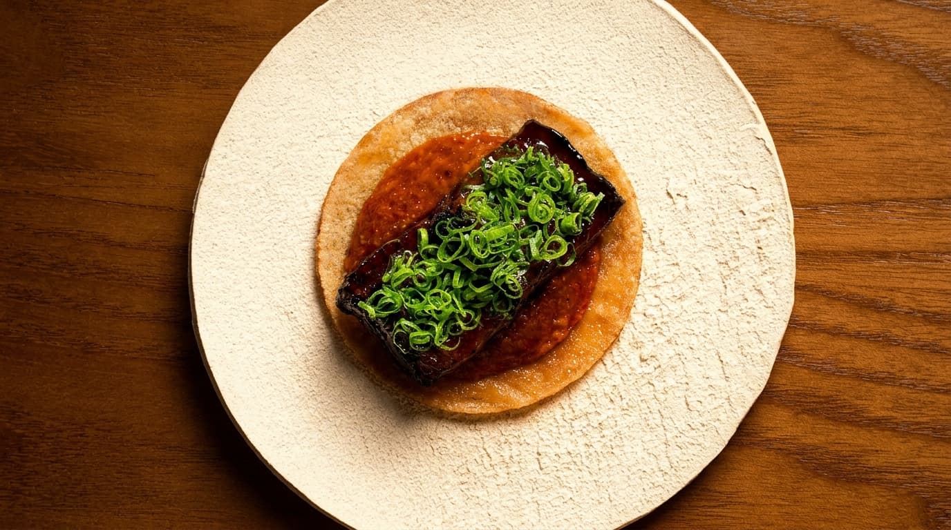 Why is the fermented sticky rice roti a textural star?